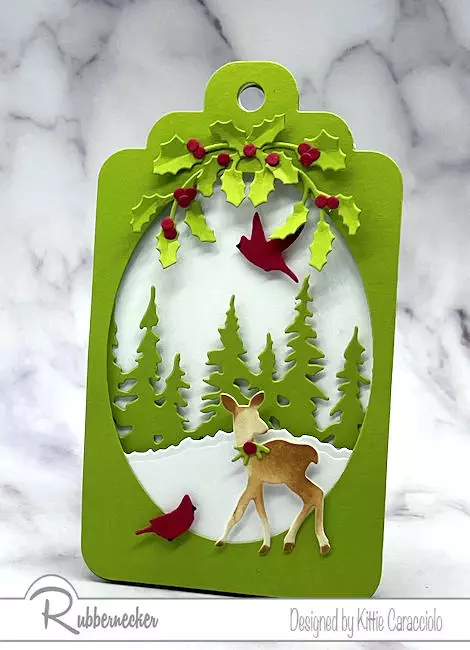 Come get a bunch of ways to use handmade holiday tags like this sweet little winter scene of a baby deer.