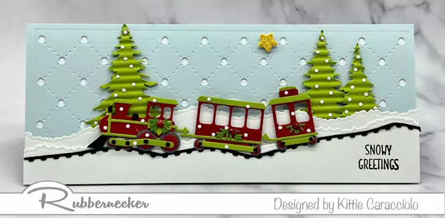 An incredible handmade toy train Christmas card made with a new die set from Rubbernecker.