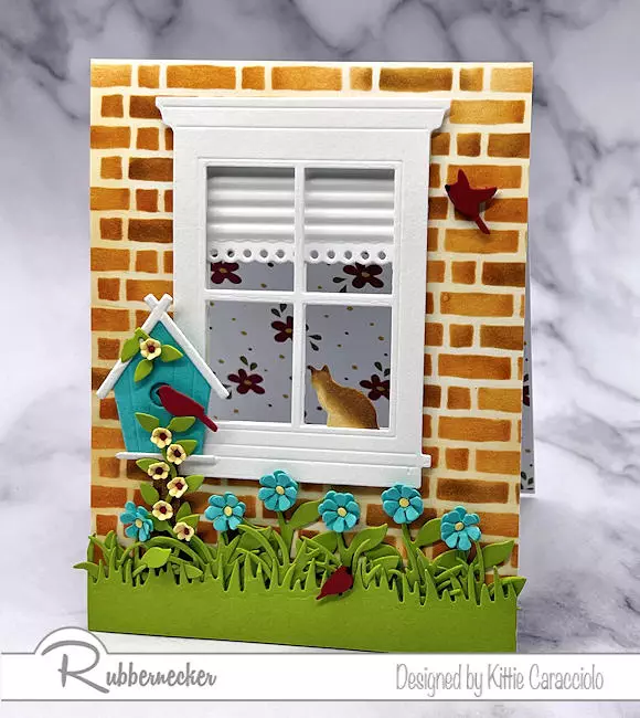A realistic see through window card made with a few simple steps to add a little extra touch to dies and die cuts from Rubbernecker.