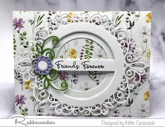 To create this beautiful detailed card with the floral patterned background, make a layered die cut circle frame and add it to the center for some textural pop and a spot for your stamped sentiment.