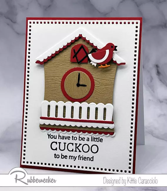A handmade die cut cuckoo clock card made using a clever add-on die to add details to a basic shape.
