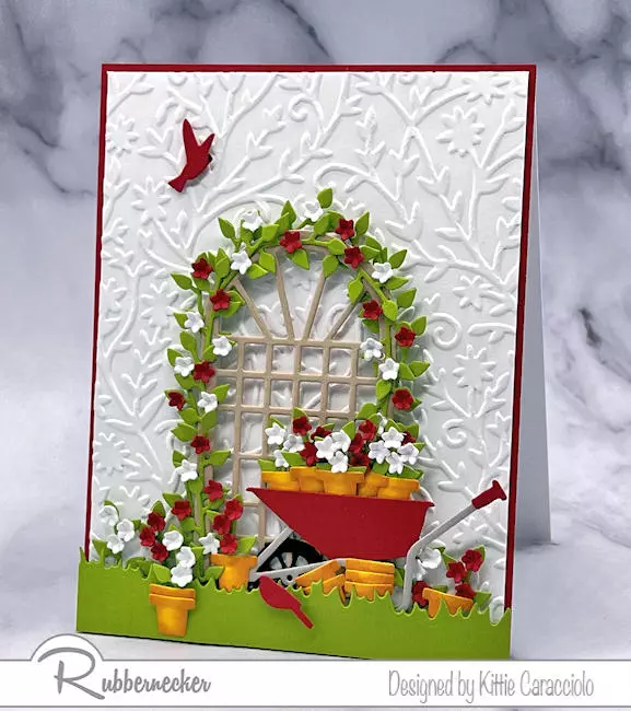 A design for handmade cards for gardeners with a simple arched trellis covered with tiny die cut flowers.