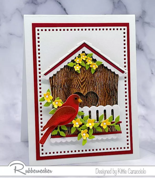 See how easy it is to use some add on dies to make a birdhouse like this realistic little cardinal cottage on this handmade card.