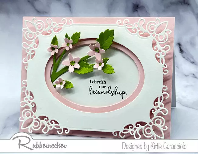 A beautiful handmade card in shades of pink that shows how to create frames with layered oval die cuts.