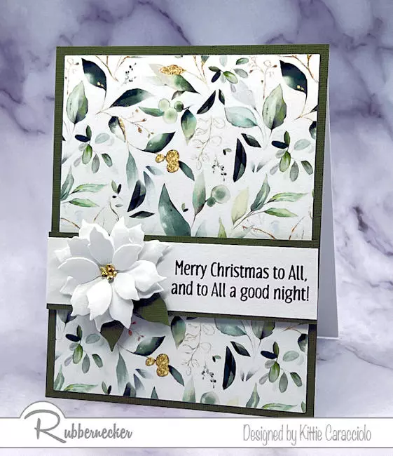 One of my fast and easy poinsettia cards made with a die cut blossom over a piece of pretty patterned paper.