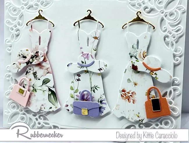 Scraps of beautiful floral patterned papers from Rubbernecker were used to create these feminine, stunning die cut paper pieced dresses set on a white on white handmade card.