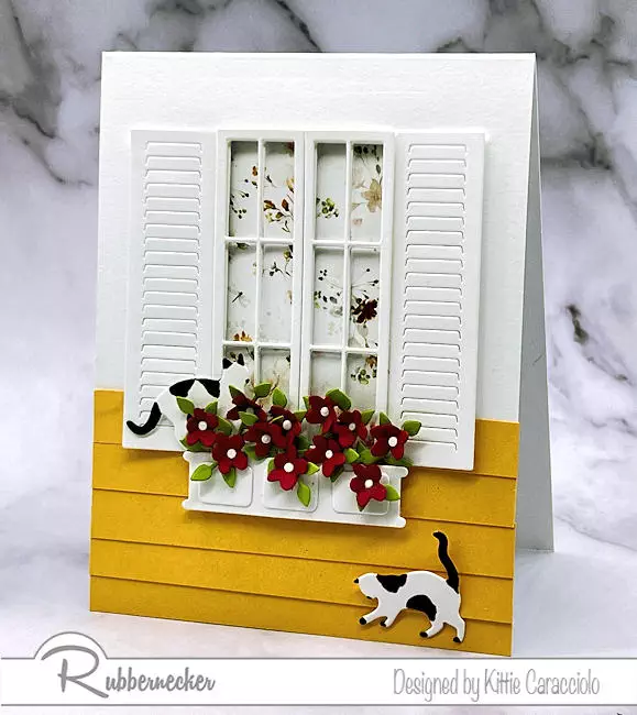 A handmade window with shutters card all made from die cuts for all the adorable, realistic details.