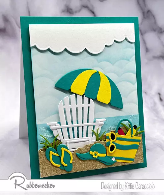 Adding details to a handmade summer card, like the ocean, sky and seafoam shown here, bring this scene to life.