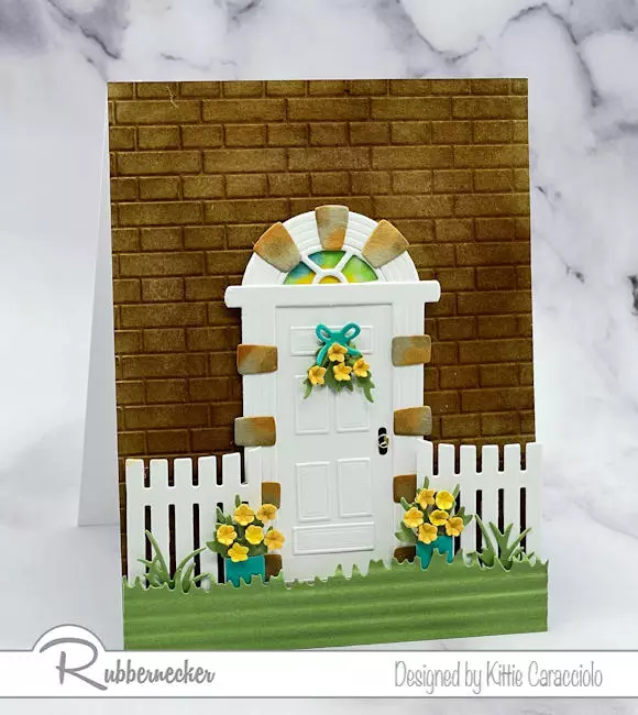 Hand inked details create a realistic entryway on this handmade card created using the new Rubbernecker door die set.