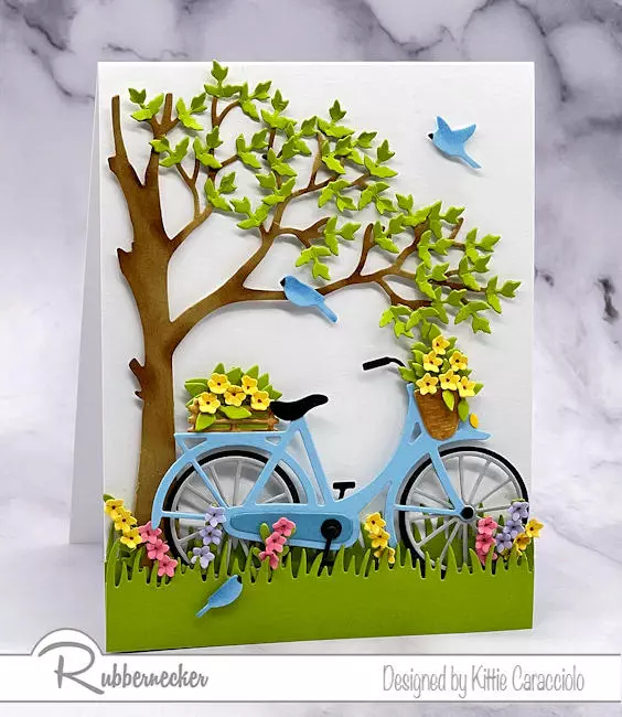 Tiny flowers and leaves along with a classic bike are set in a scene on today