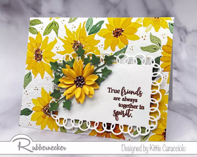 A bright and cheery handmade die cut sunflower card created with a single die cut blossom over a coordinating piece of sunflower paper.