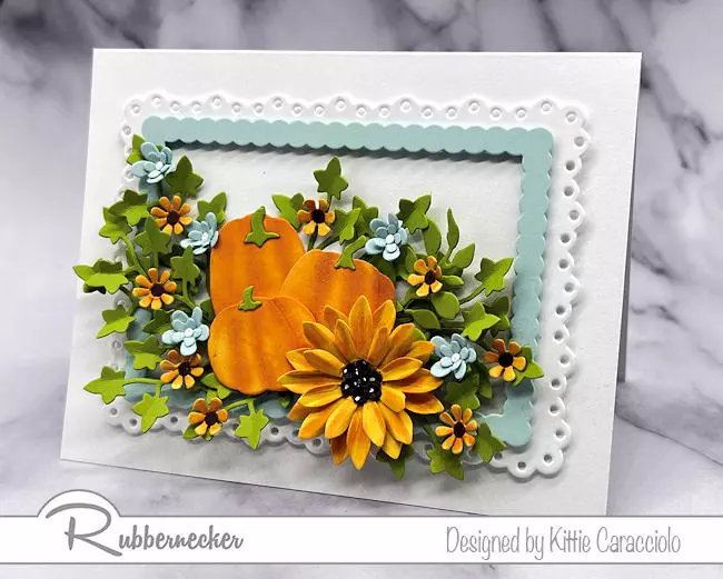 A fall floral card made with die cuts and touches of ink to add the depth and dimension to the flowers, pumpkins and beautiful sunflower.