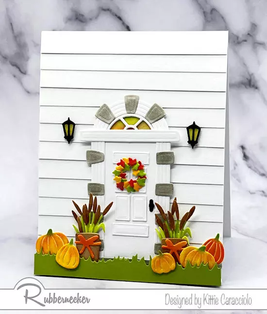 A fall door card made with die cuts for the entire door and all the charming little decorations.