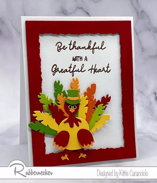 An adorable die cut turkey card made with a new die set from Rubbernecker to make the main character, complete with his silly facial expression.