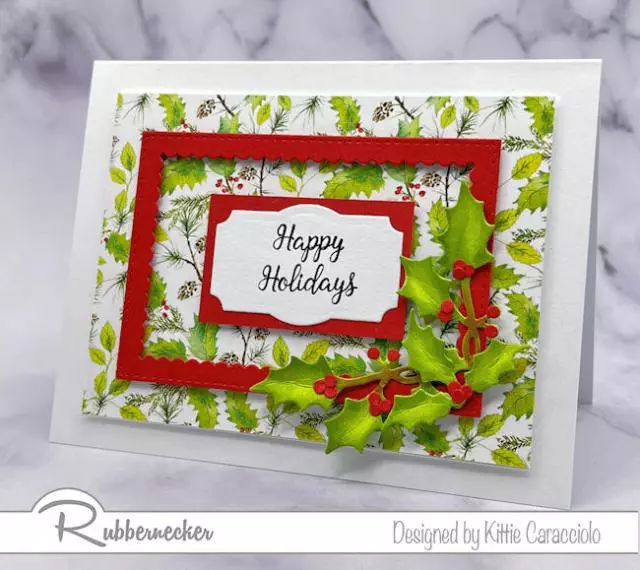 A simple handmade holly card made easily with dies for the frame and hand inked holly sprig on the corner.
