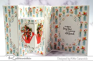 Loads of details made with die cuts to create the decorative layers and flower filled watering cans turn this Semi Funky Fold Accordion Card template into something special!