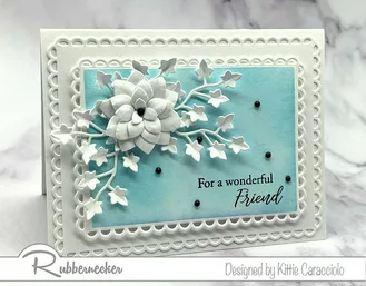 One of the beautiful monochromatic cards to make using dies, stamps and inks from Rubbernecker to create the dimensional white die cut flower and foliage over a hand inked soft blue background.